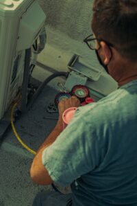 HVAC technician installing central air conditioning in Connecticut